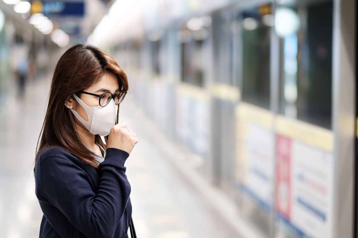 young asian woman wearing surgical mask