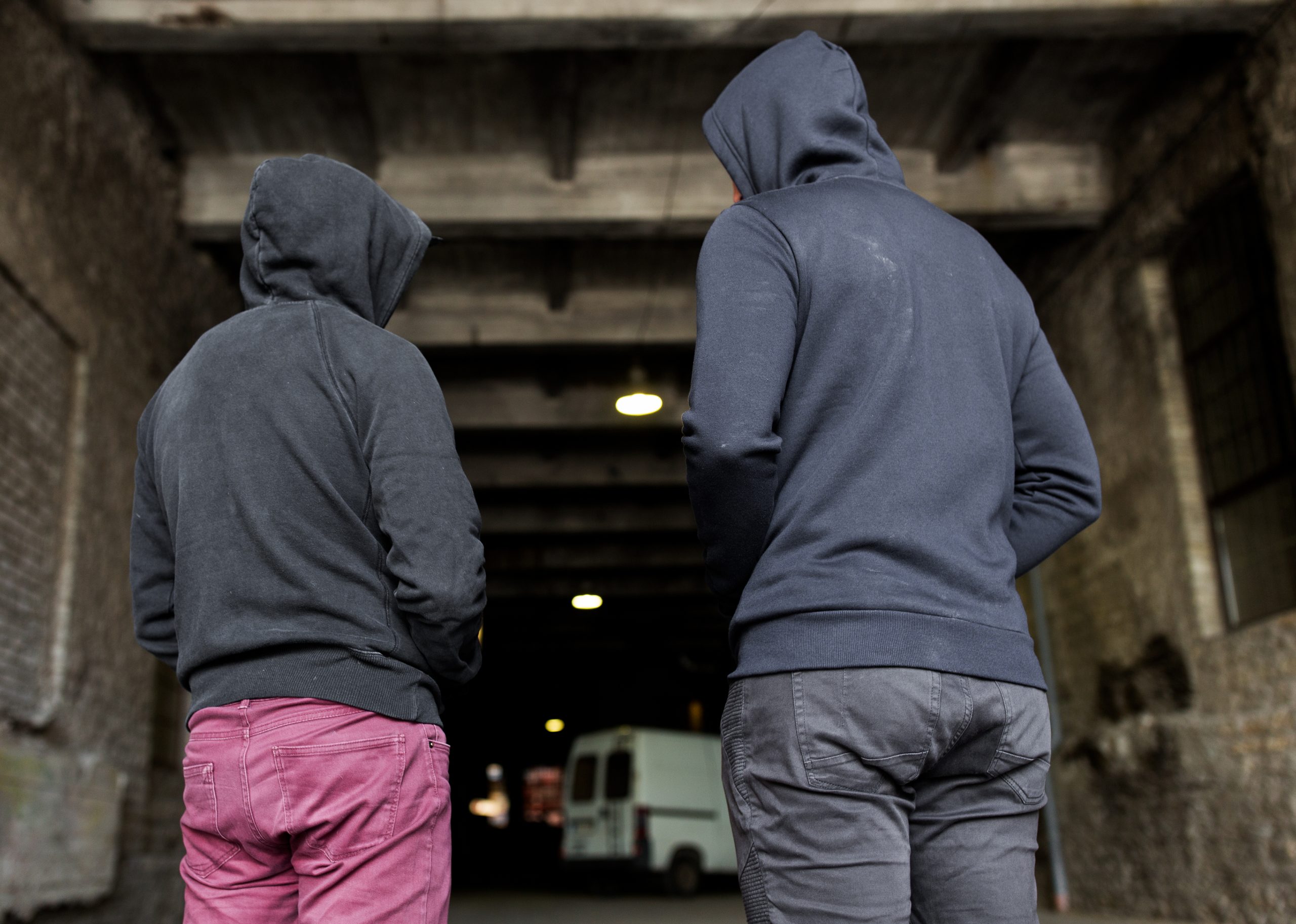 criminal activity addiction people social problem concept close up addict men criminals hoodies street scaled