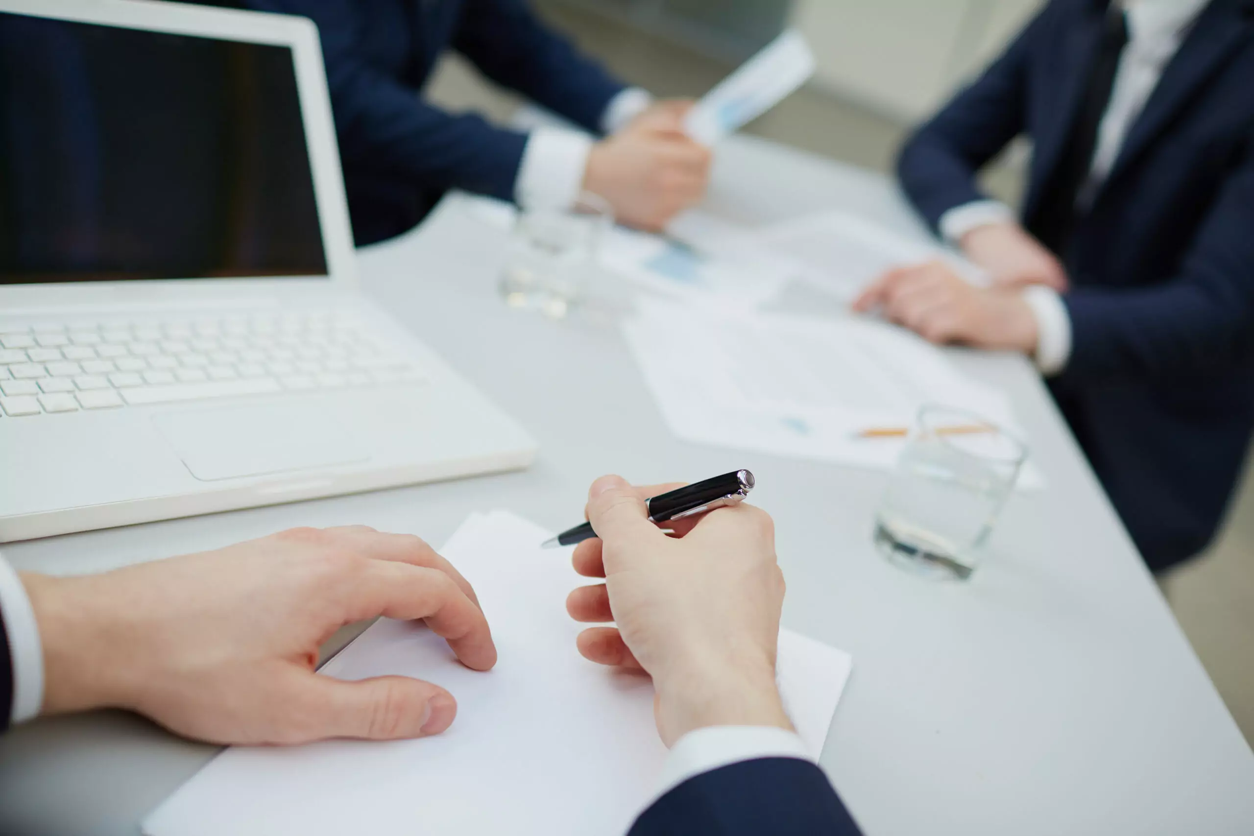 close up executive writing scaled