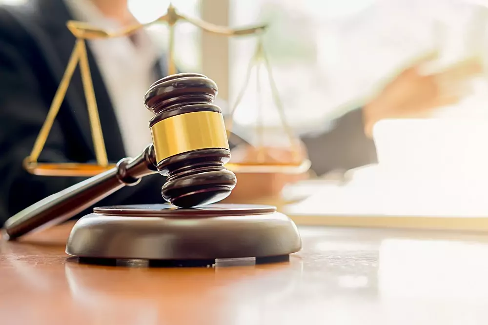 judge gavel with justice lawyers having team meeting law firm background