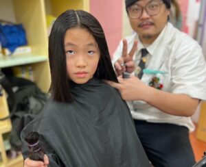 新生醫專攜手幼兒園 寒冬暖心捐髮助癌友