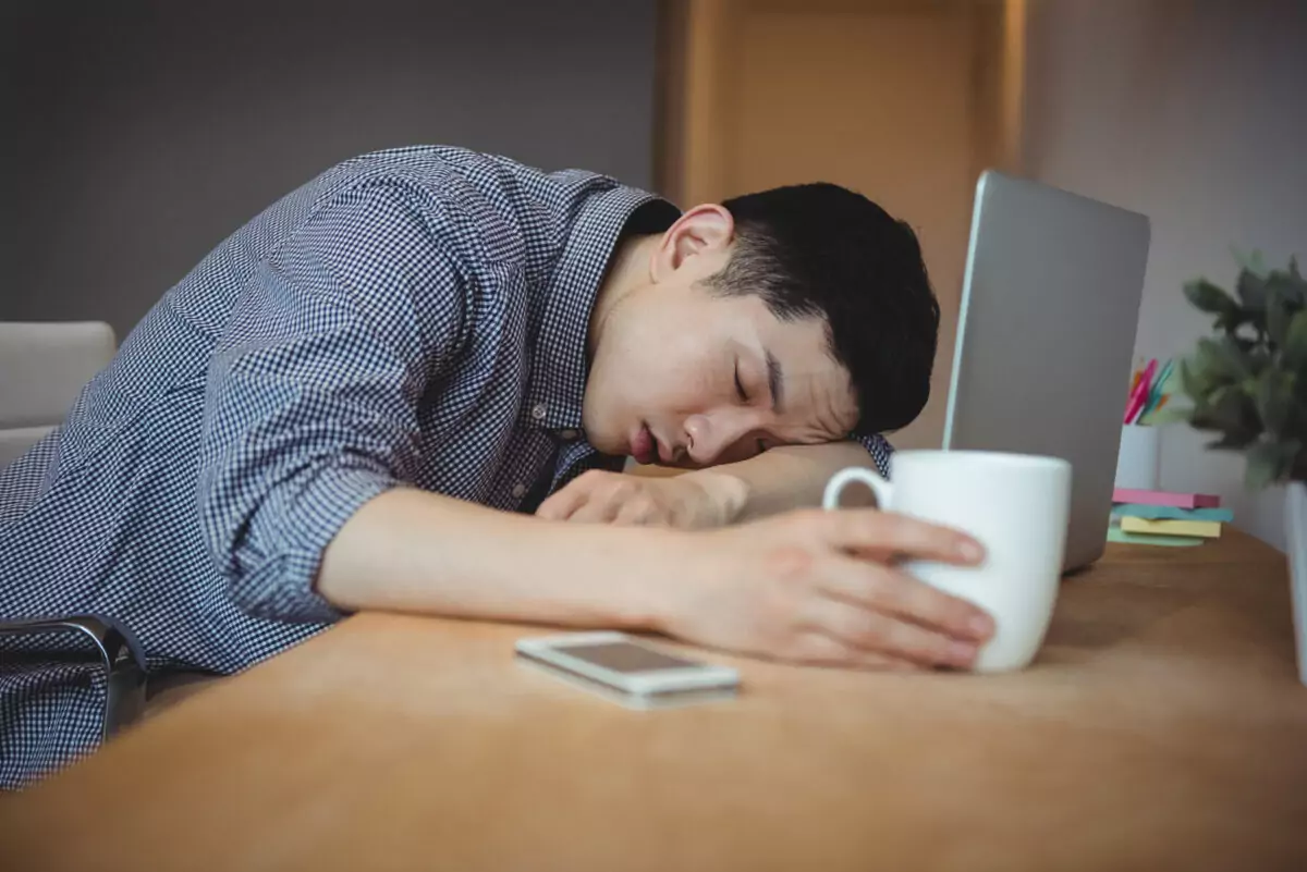 business executive sleeping his desk